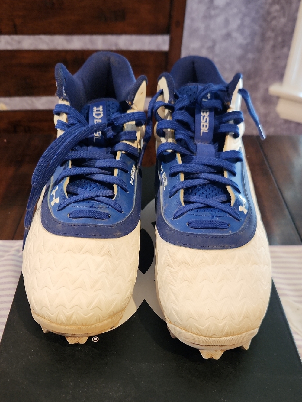 Under Armour Kids Blue and White Cleats with Lace-Up Closure